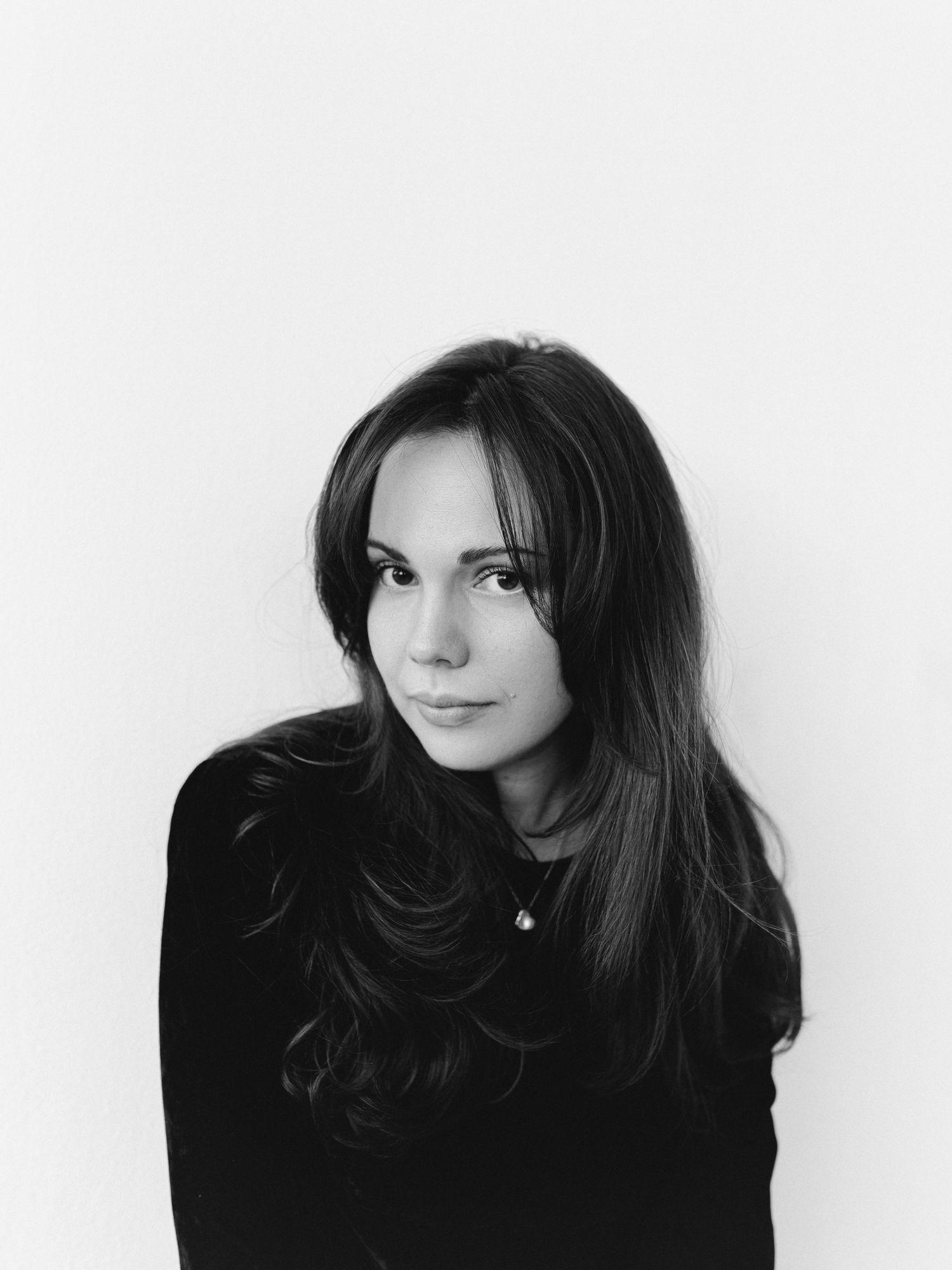 Alexandra Yangel, studio portrait against a white wall
